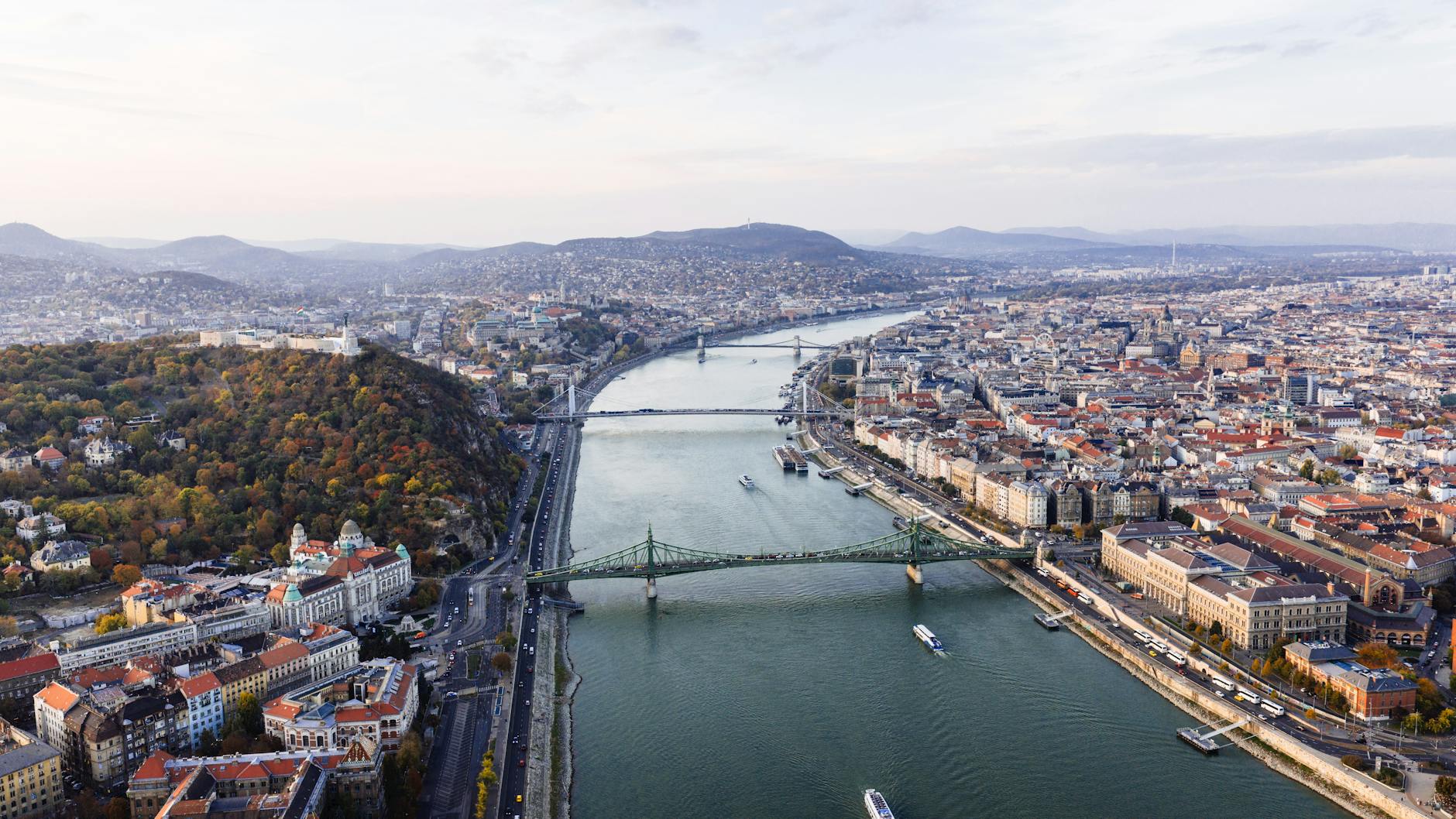 Things to do in Budapest - stunning aerial panoramic view showing the Danube River and bridges