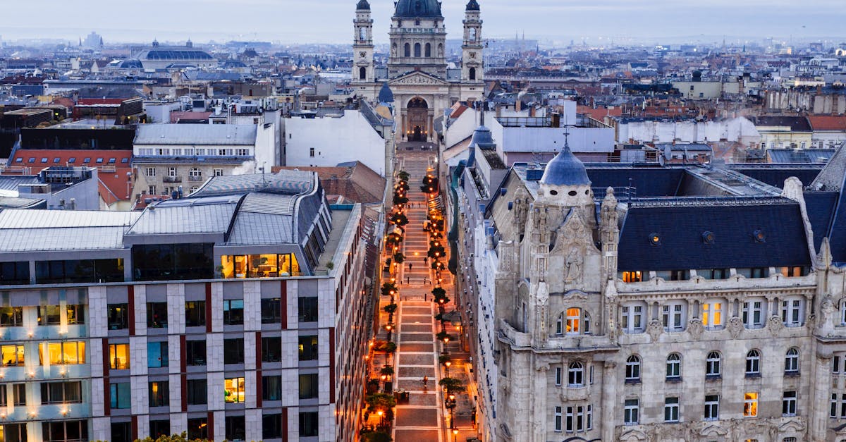 A scenic view of a Budapest shopping street with historic architecture and shop fronts