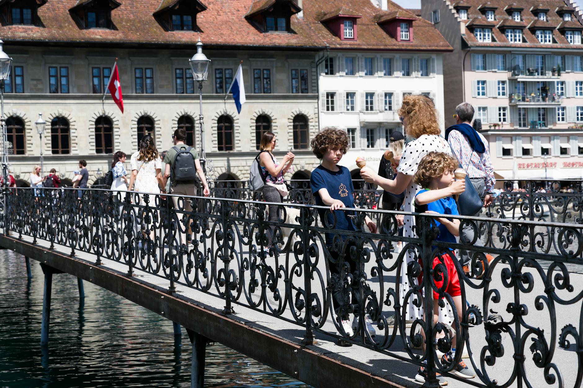 Family enjoying a sunny day in Budapest with kids along the Danube promenade