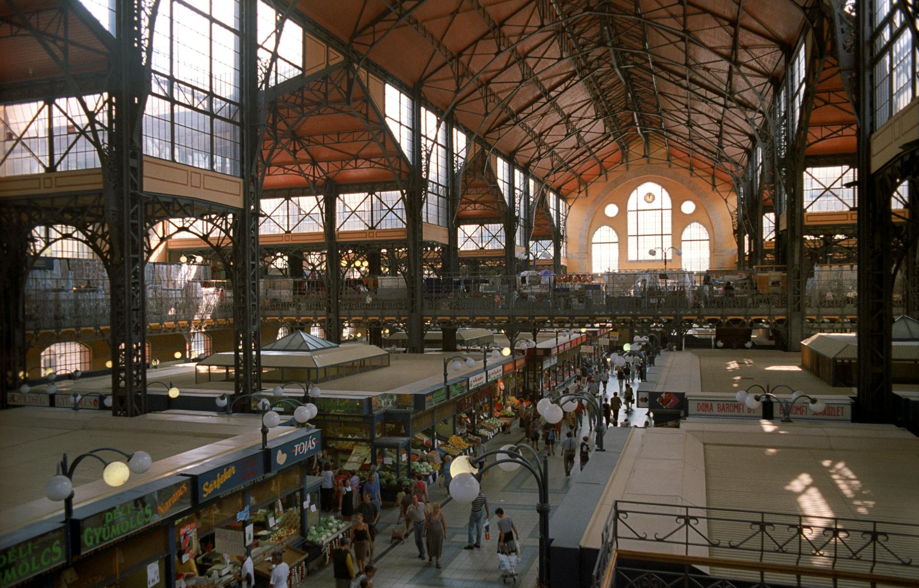 Interior of the Great Market Hall in Budapest showing colorful vendor stalls