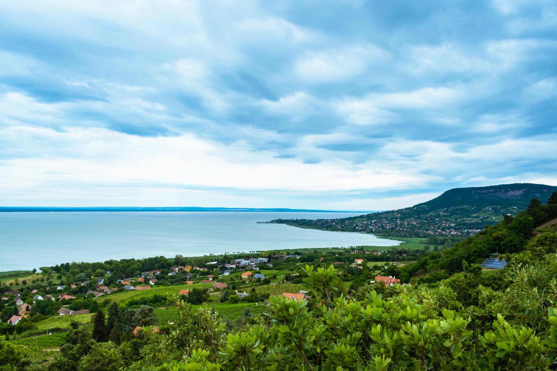 Turquoise waters of Lake Balaton with Tihany Abbey, a scenic day trip from Budapest in summer