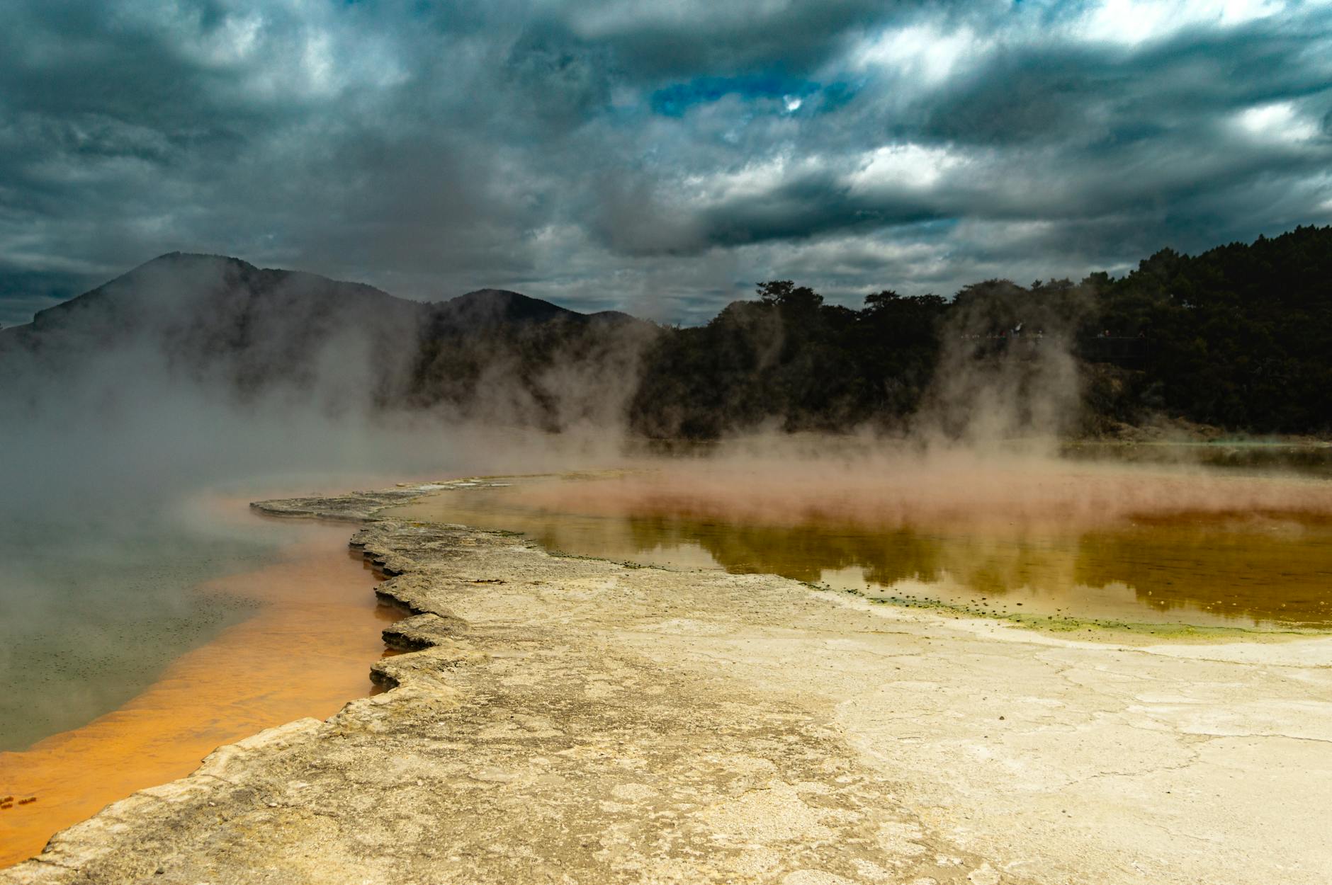 Thermal pool at night with steam and party atmosphere