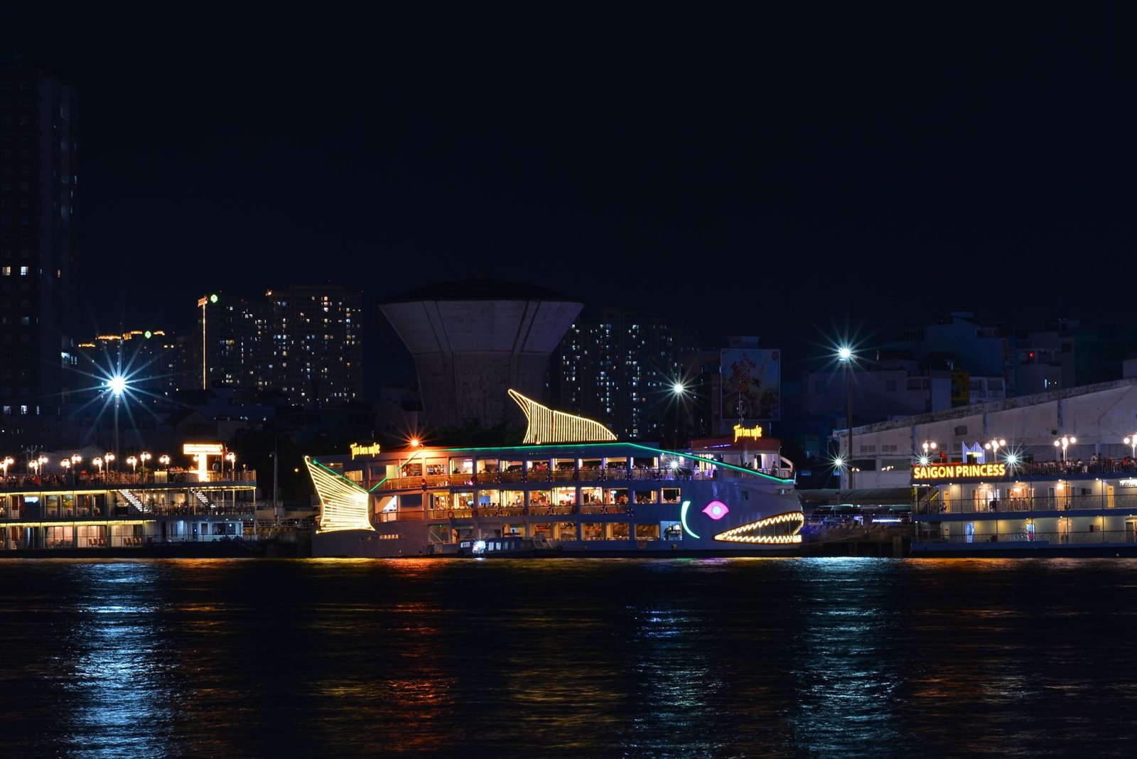 Danube river cruise past floodlit Budapest at night