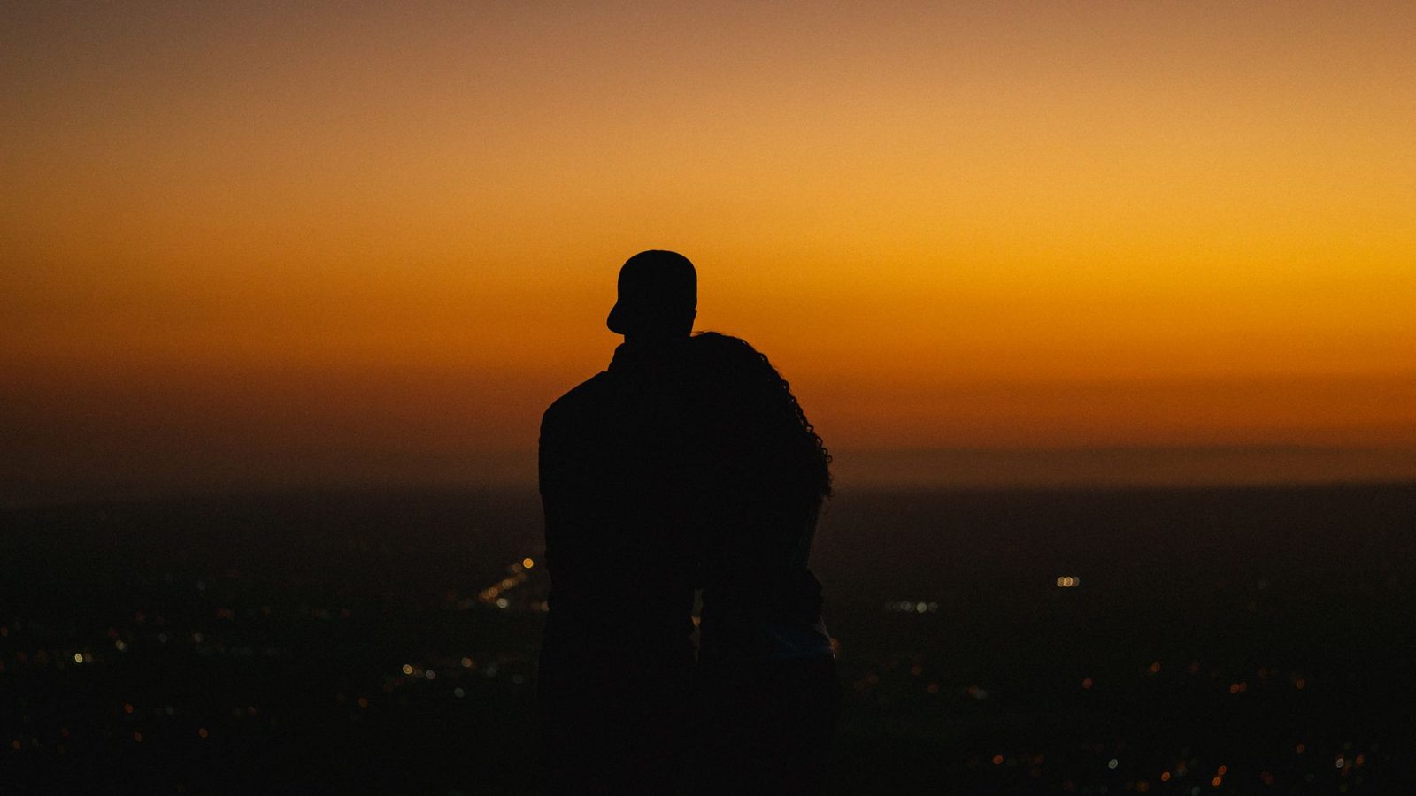 Budapest honeymoon: a couple enjoying a romantic city view at sunset