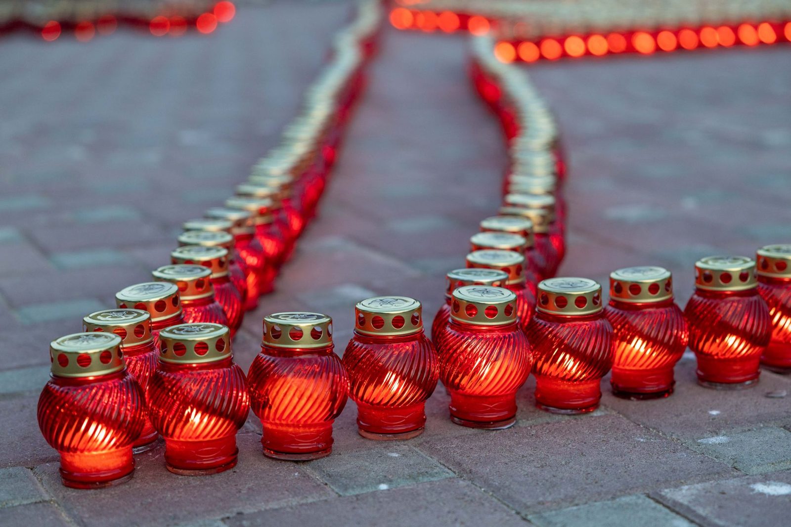 Candles lit in remembrance of victims of two regimes