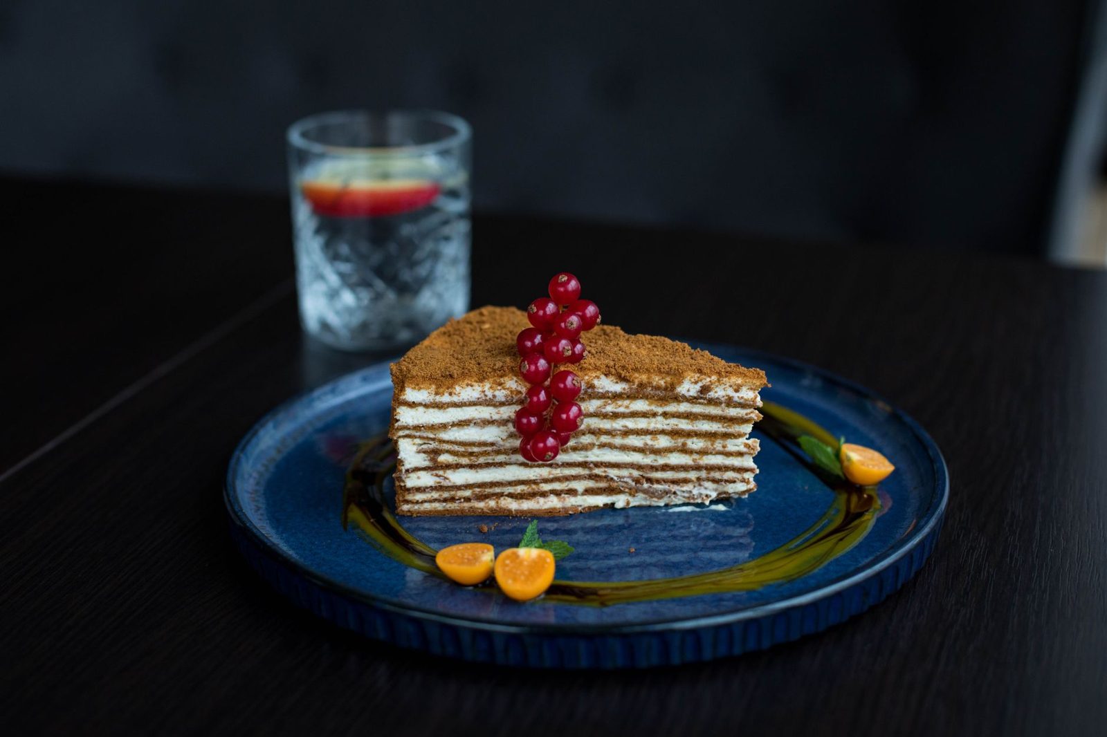 A slice of Hungarian layer cake served with coffee