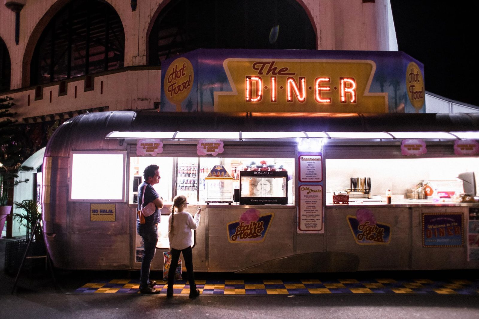 Food trucks at a Budapest street food court in the evening