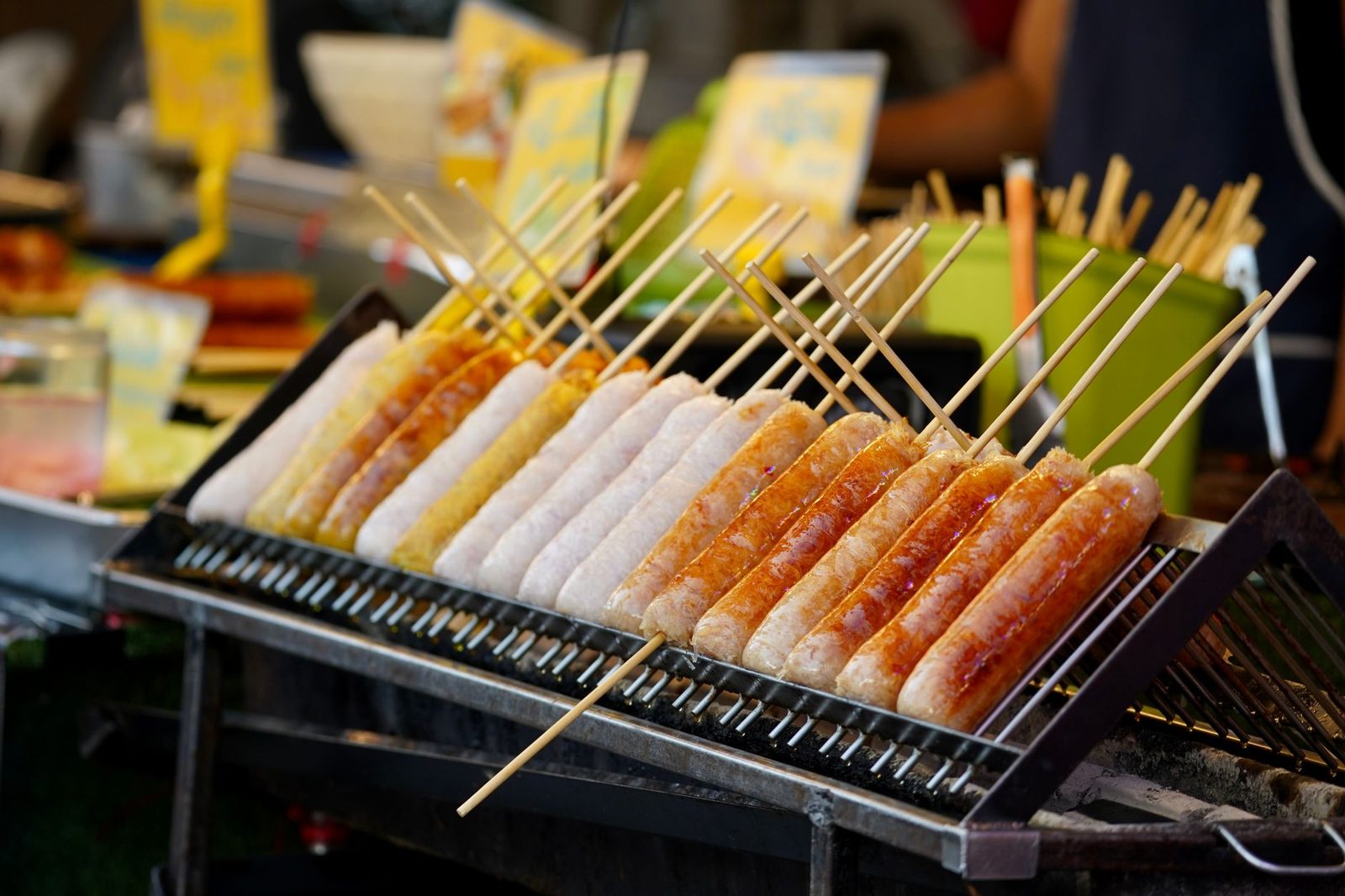 Grilled kolbász sausage with bread and mustard at a market stall
