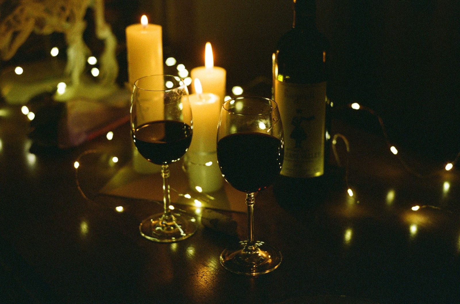 Candlelit dinner table set for a romantic Budapest dinner cruise
