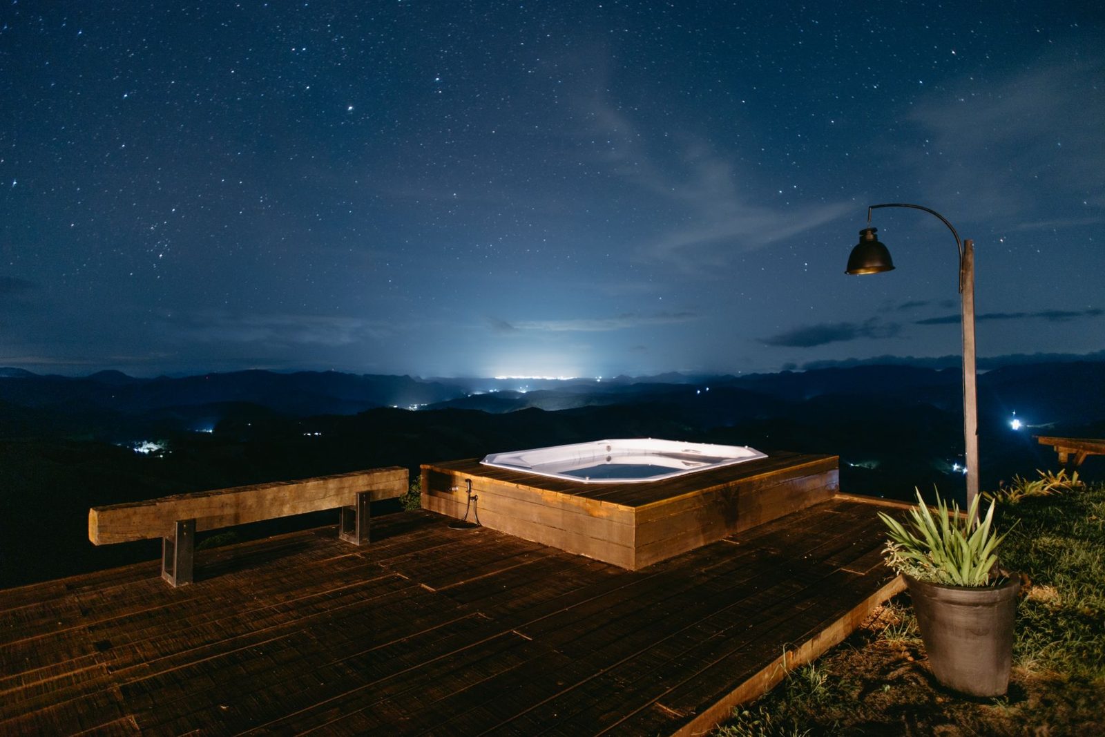 Rooftop thermal hot tub overlooking the city at dusk
