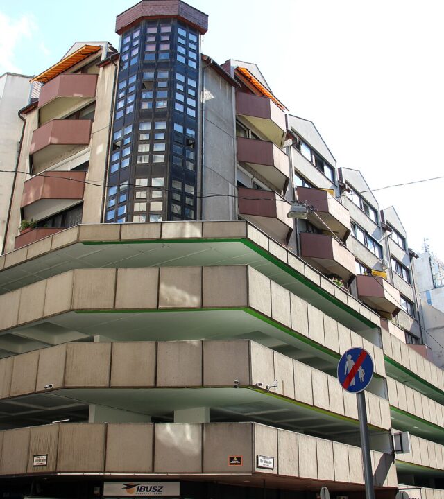 The concrete decks of the multi-storey car park on Aranykéz utca in central Budapest, with apartments built on top