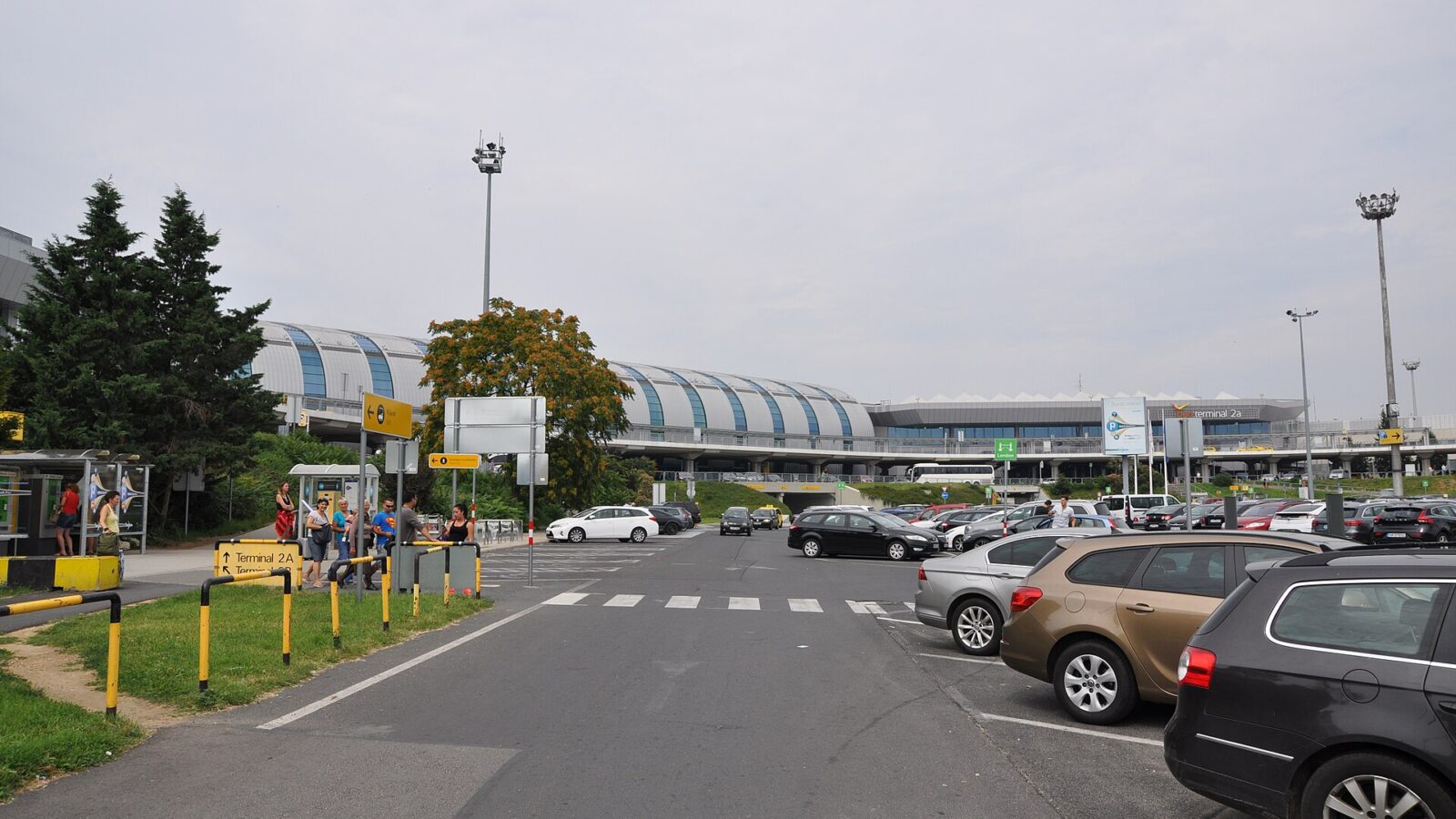 The exterior of Terminal 2A at Budapest Airport, showing the curved glass roof of the Skycourt building