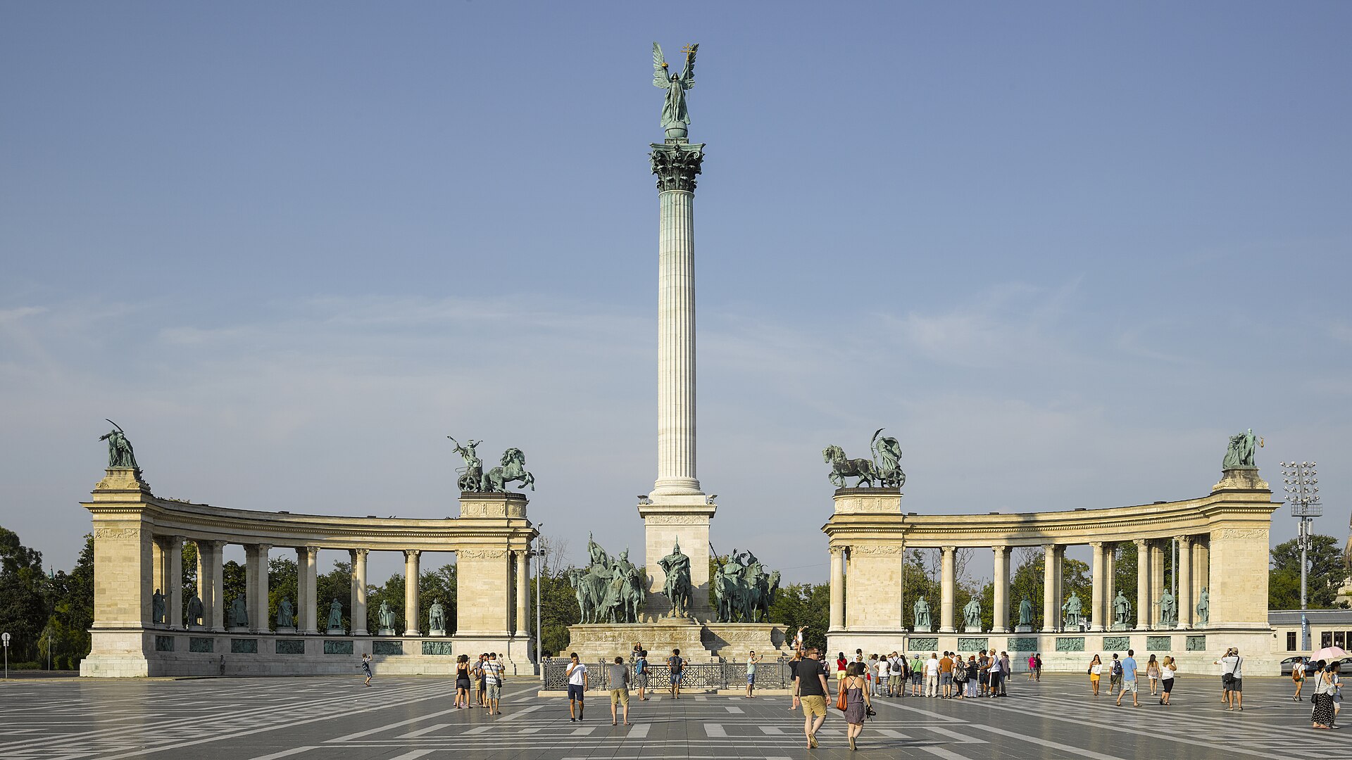 Heroes' Square in Budapest with the Millennium Monument column, the Archangel Gabriel statue and the two curved colonnades of bronze rulers