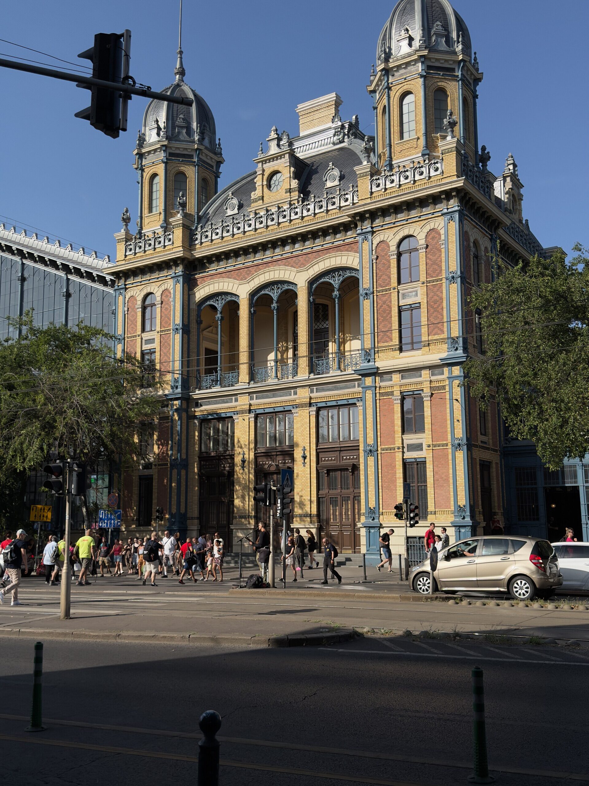 An ornate corner tower of Budapest's Nyugati railway station complex, with decorative brickwork and a domed roof