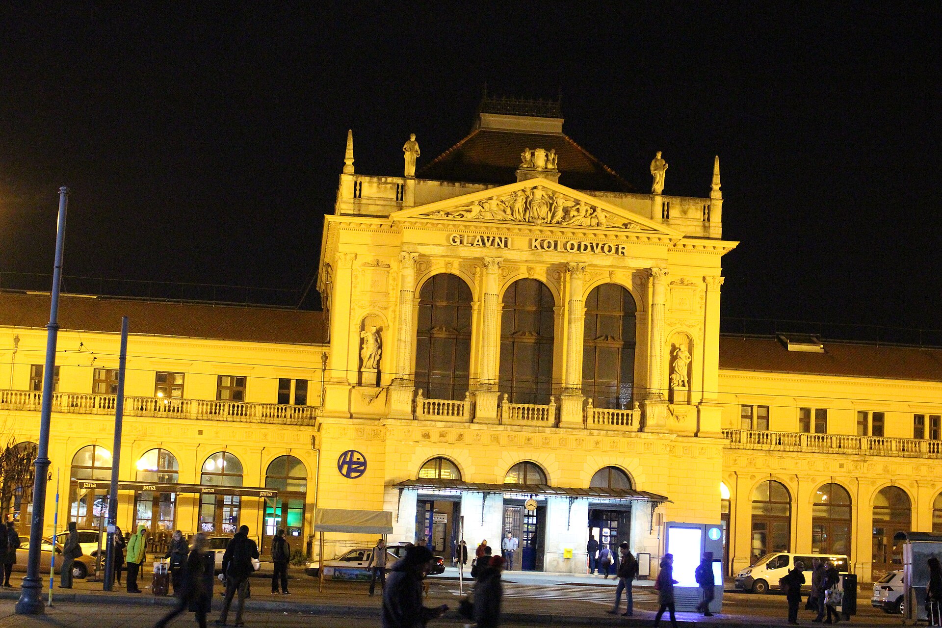 The grand illuminated facade of Zagreb's main railway station, Glavni kolodvor, at night